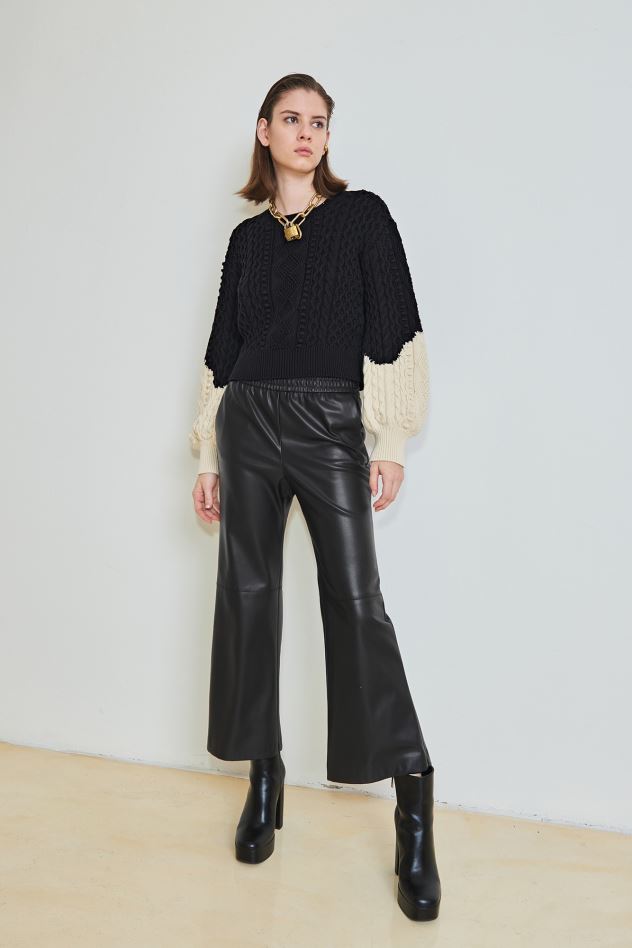 (NUDE) FALL 22 COLLECTION IMAGE: PRODUCTS FEATURED: (NUDE) FLAIR TROUSER WITH ELASTIC WAIST, (NUDE) CABLE KNIT SWEATER