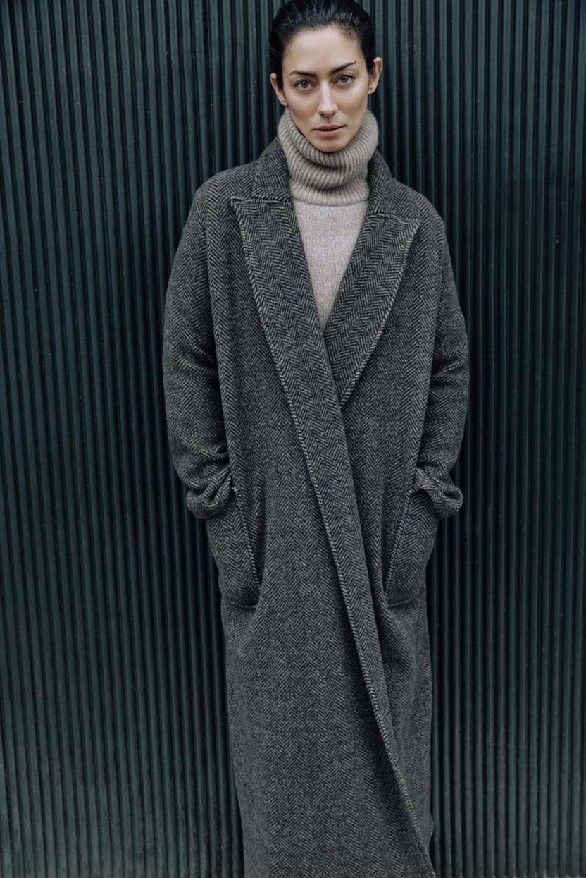 DUSAN FW25 COLLECTION IMAGE SHOWING MODEL WEARING HOUNDSTOOTH LONG COAT