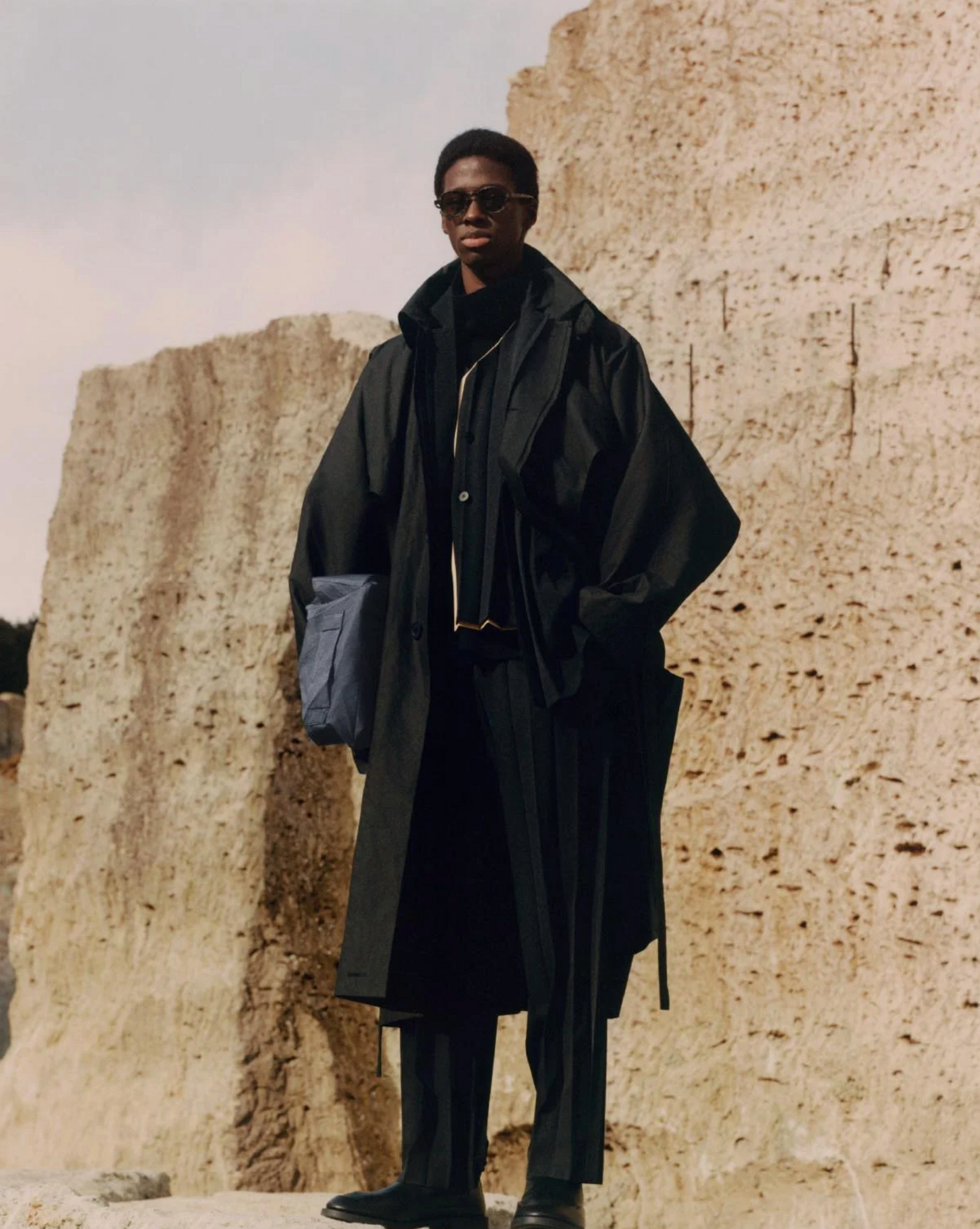 ISSEY MIYAKE FALL 22 COLLECTION IMAGE: PRODUCTS FEATURED: GEM PLEATS TOP, GEM PLEATS PENCIL SKIRT, ALT BLINKS DRESS, ALT BLINKS TROUSERS, MAISON MARGIELA TABI BOOTS