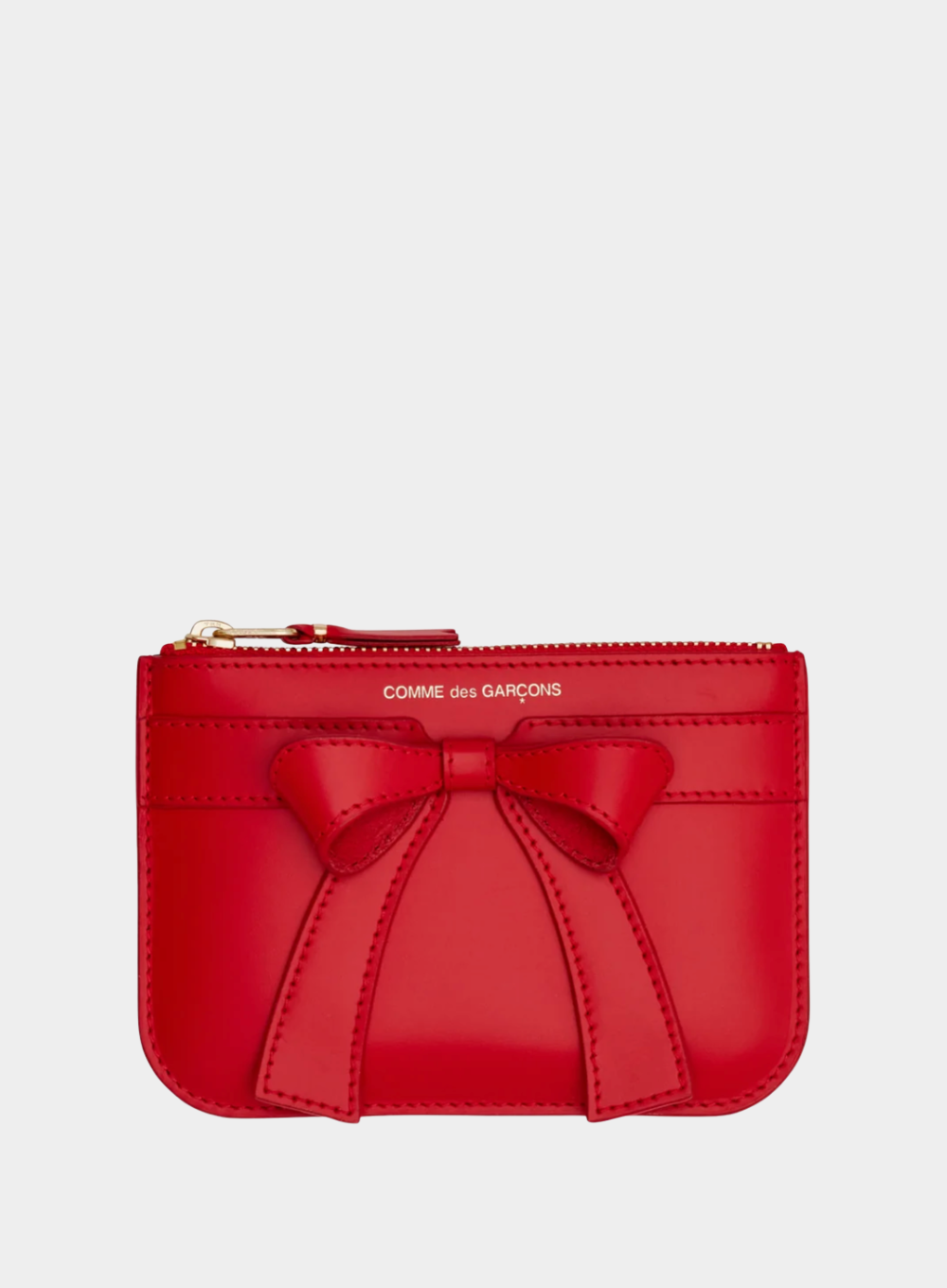 Red wallet with a bow on a light gray background