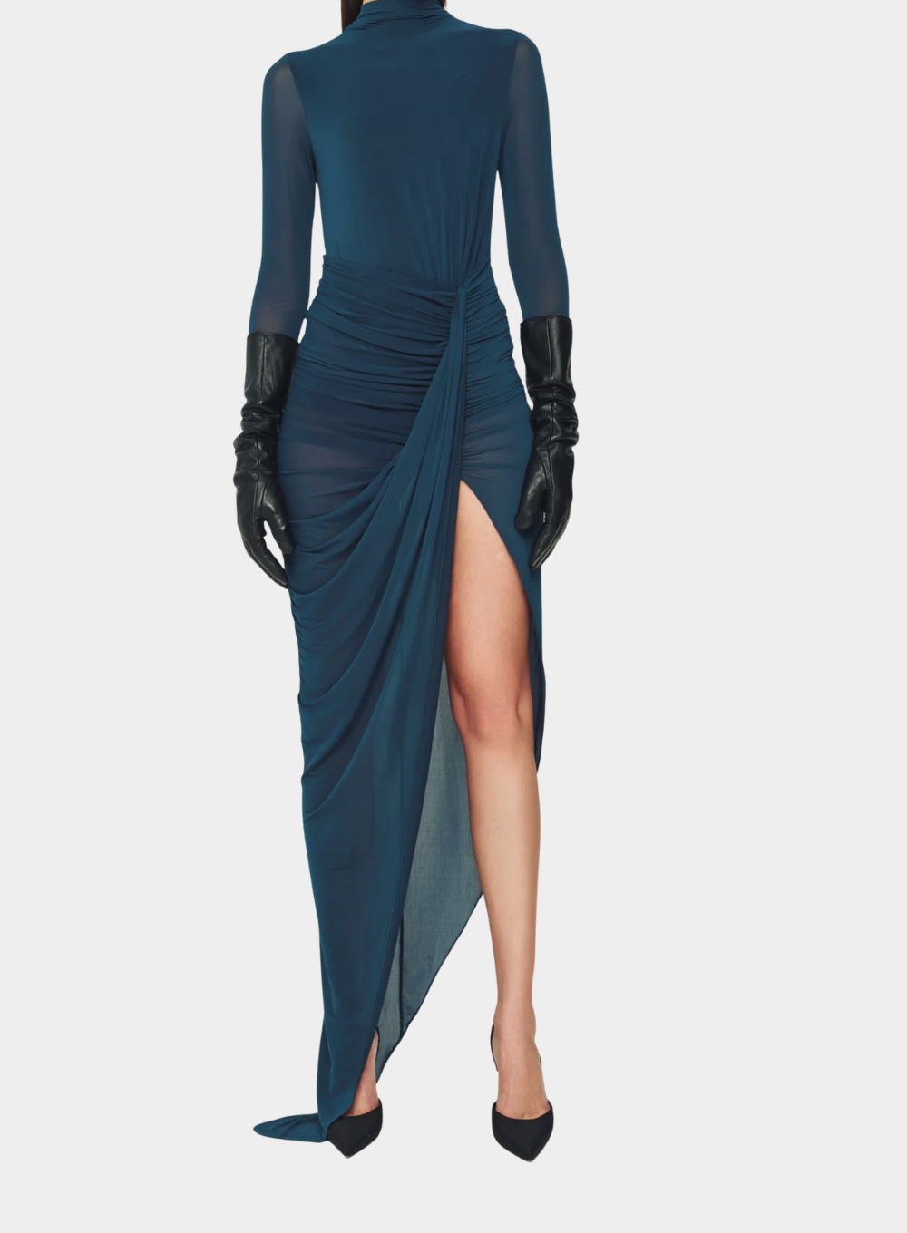 Teal dress with a high slit and black gloves on a white background
