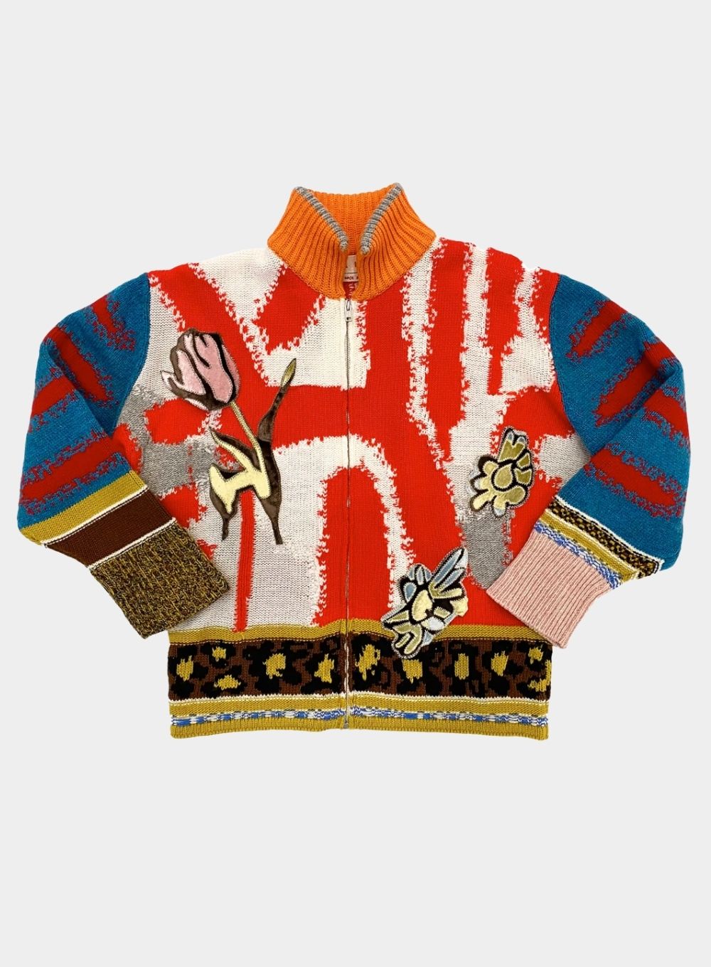 Colorful sweater with abstract patterns on a white background