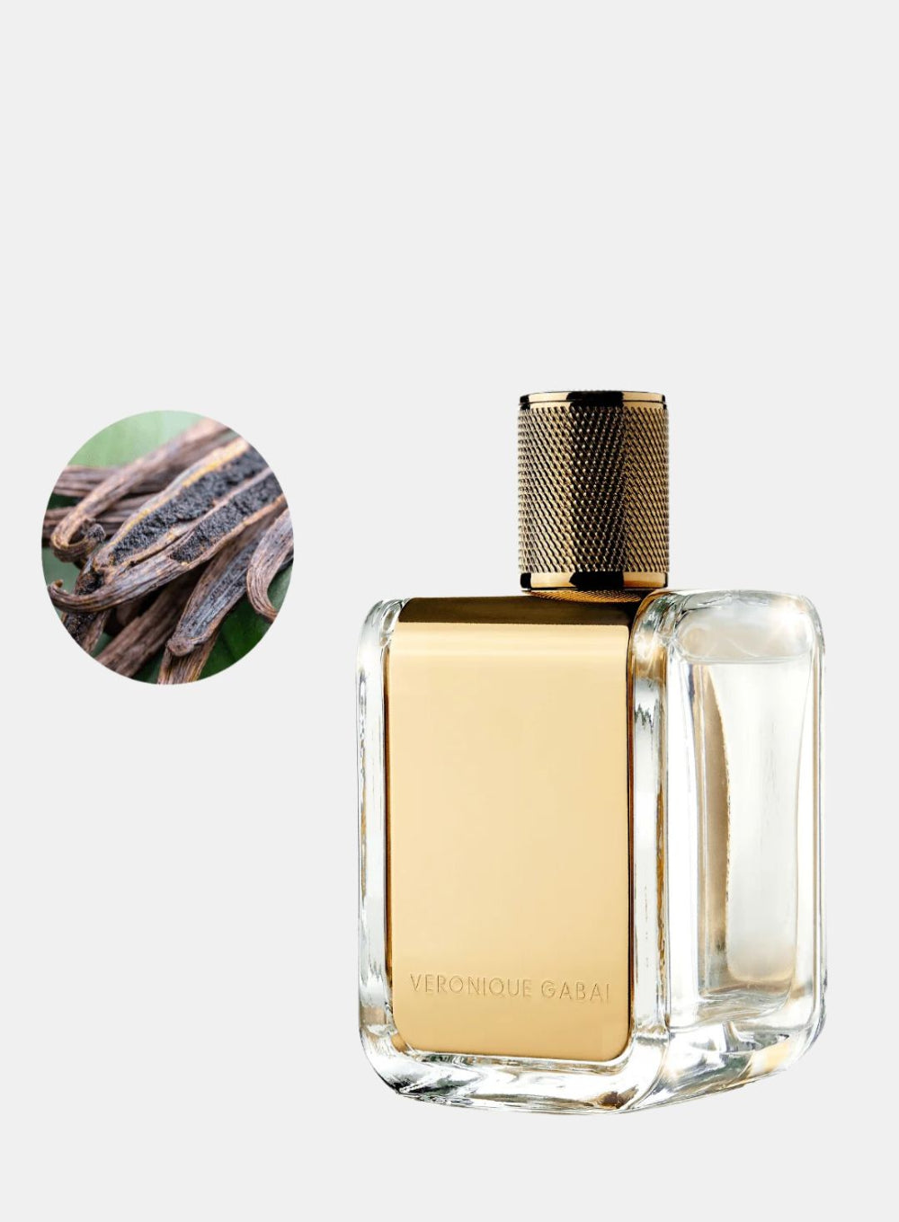 Perfume bottle with gold cap and clear body on a white background, featuring a close-up of vanilla beans.
