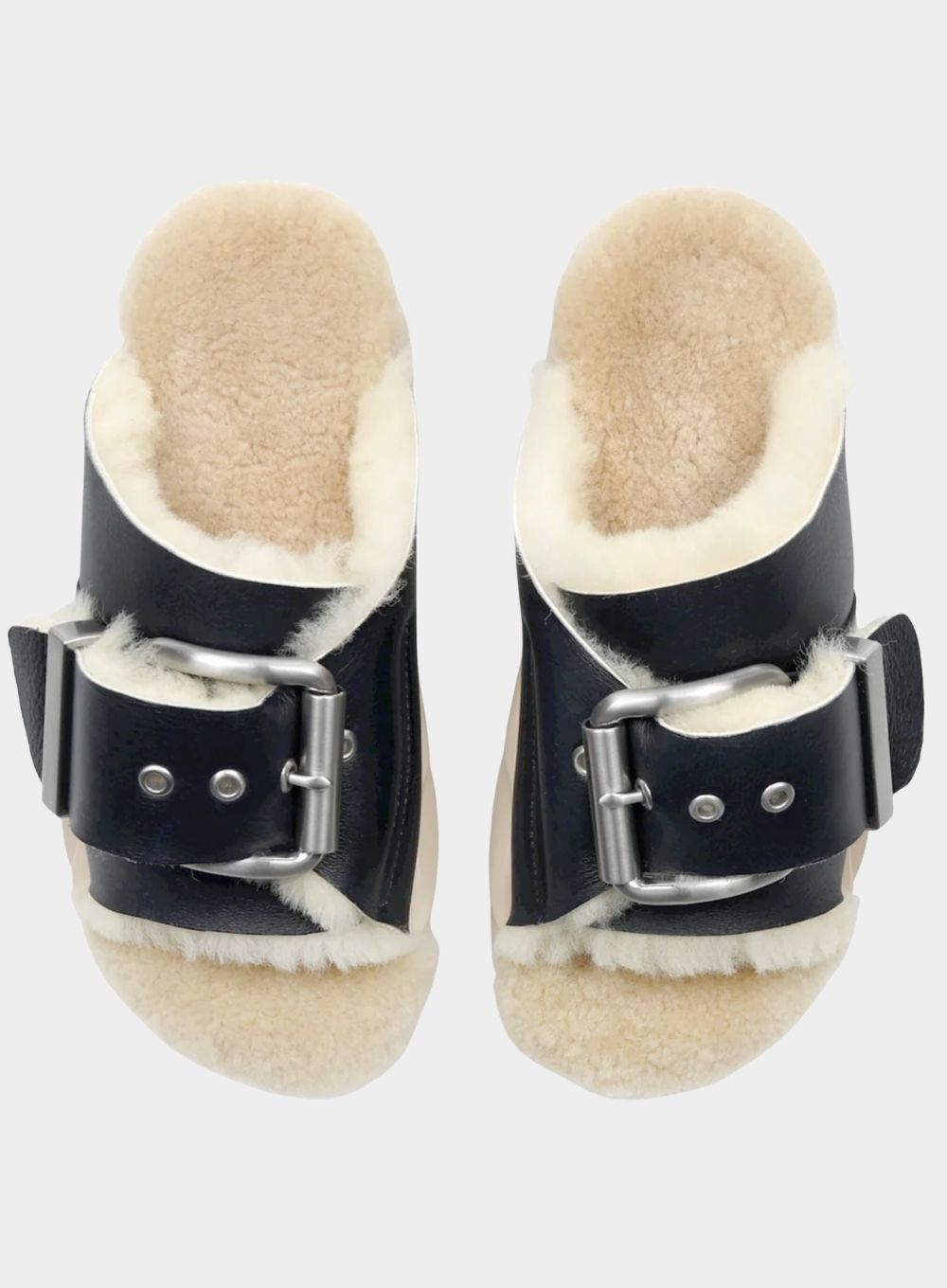 Pair of black sandals with shearling lining on a white background