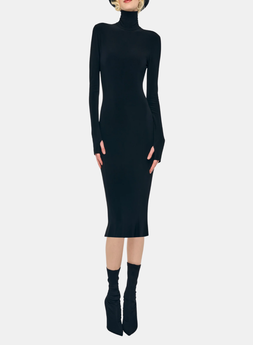 Black turtleneck dress worn by a model on a white background