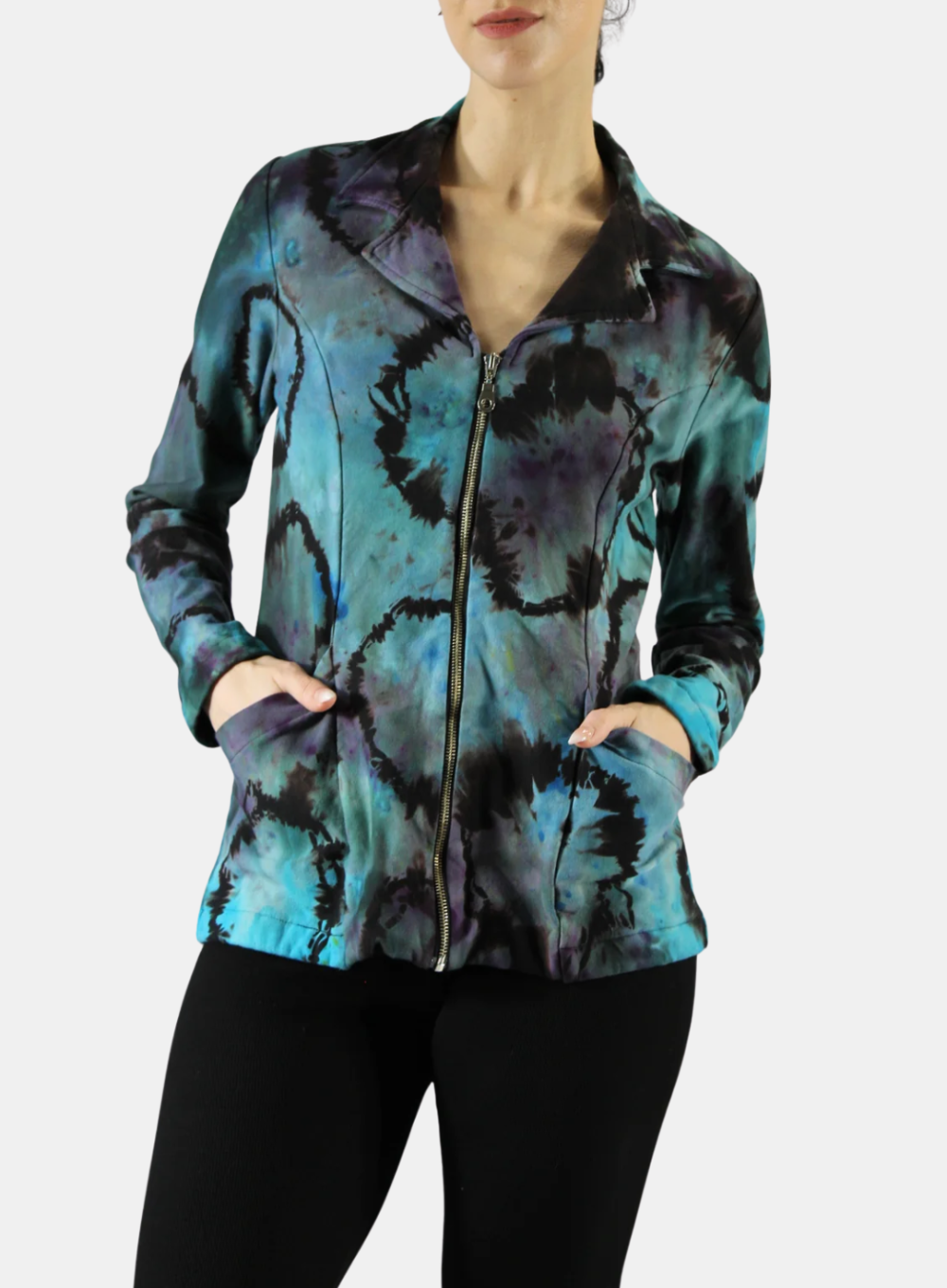 Person wearing a tie-dye jacket with blue and black patterns on a white background